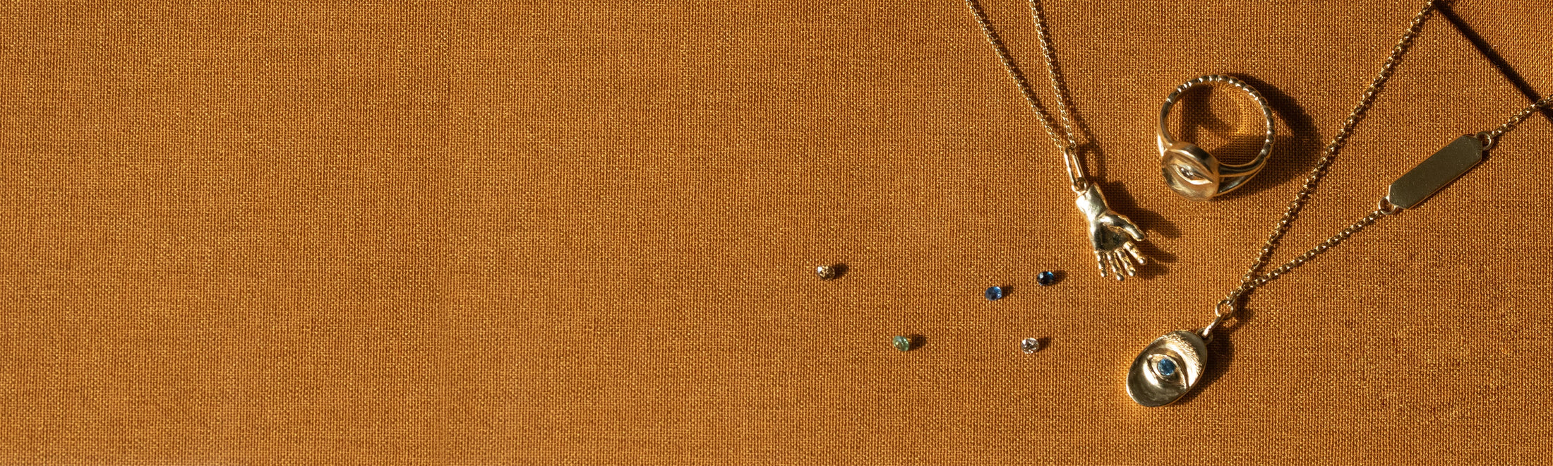 Group of rings, pendants, and earrings from the Intagliaux collection by Alfonzo