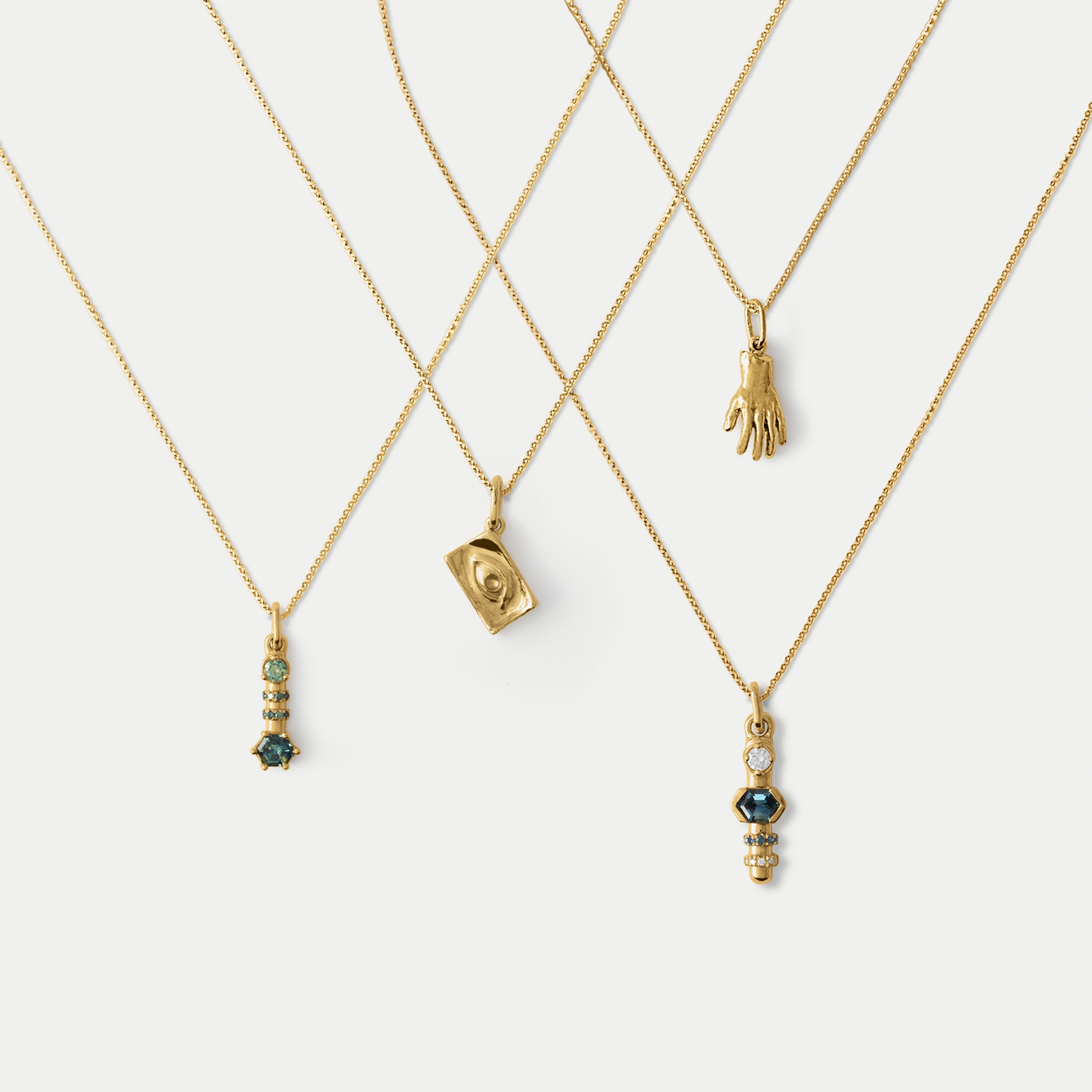 Four necklaces on a white background