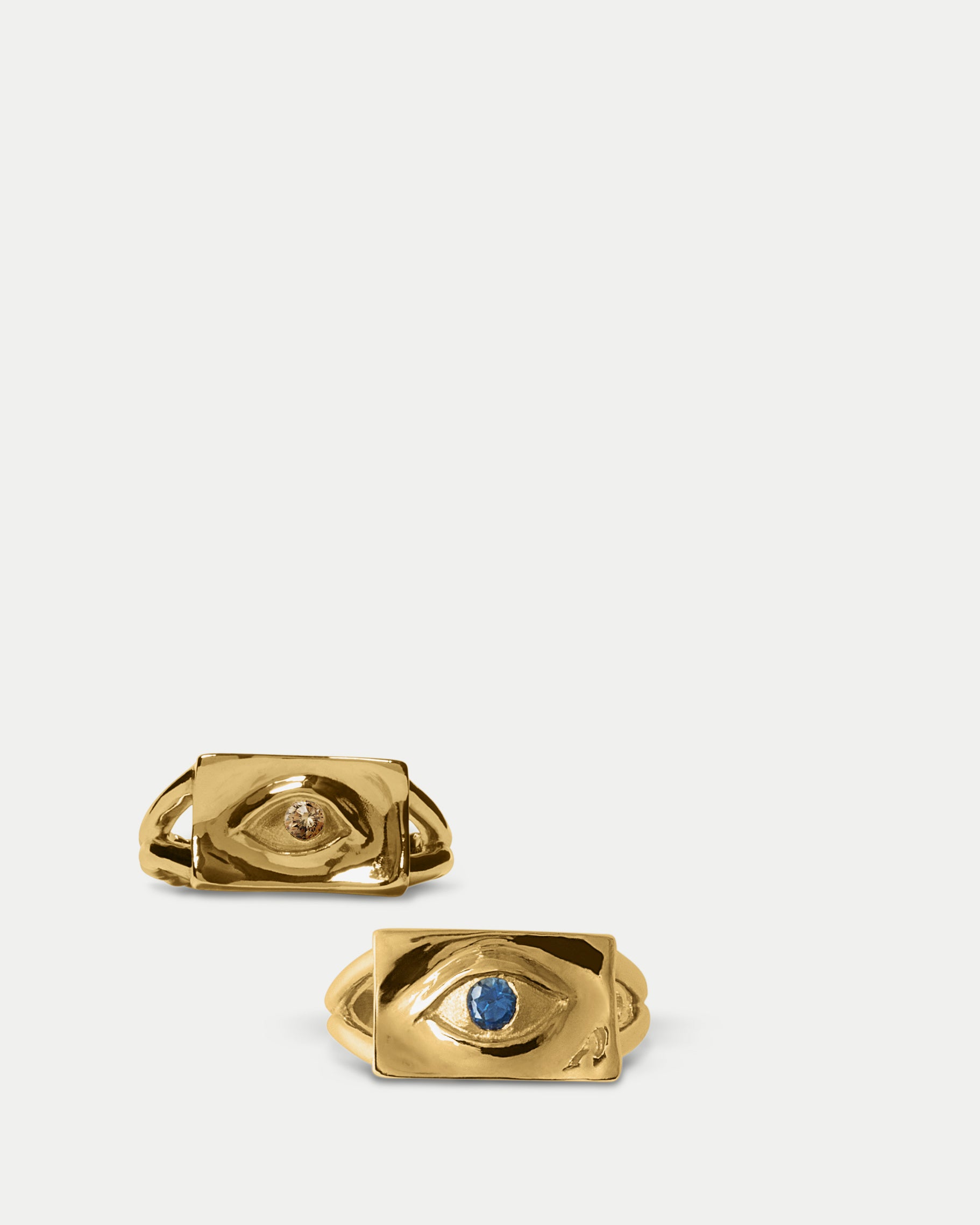 Front view of Classic Amico Ring ft. Blue Sapphire in 14k yellow gold and Classic Amico Ring ft. Champagne Diamond in 14k yellow gold