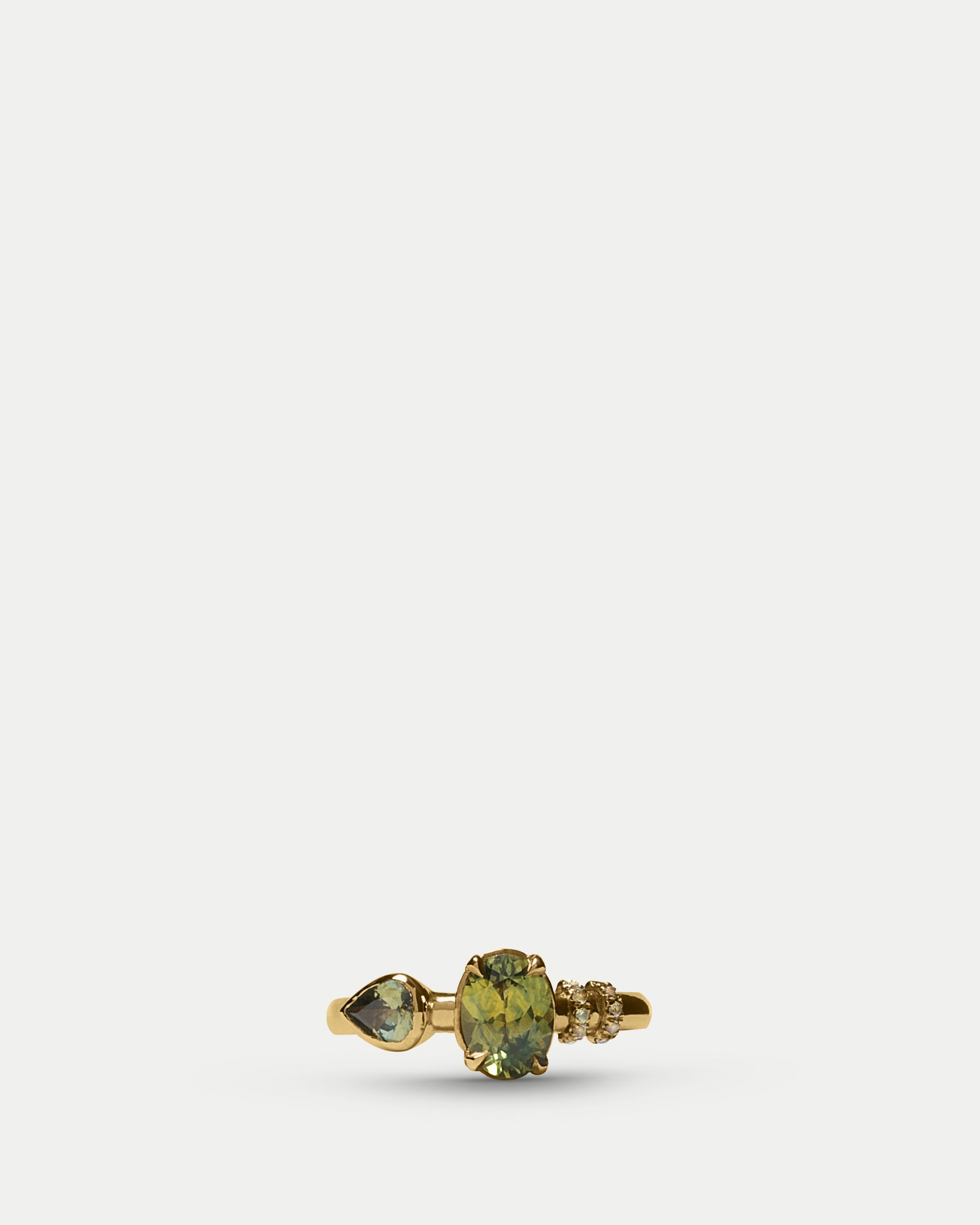 Front view of Monoceros Ring ft. Oval Sapphire in 14k yellow gold