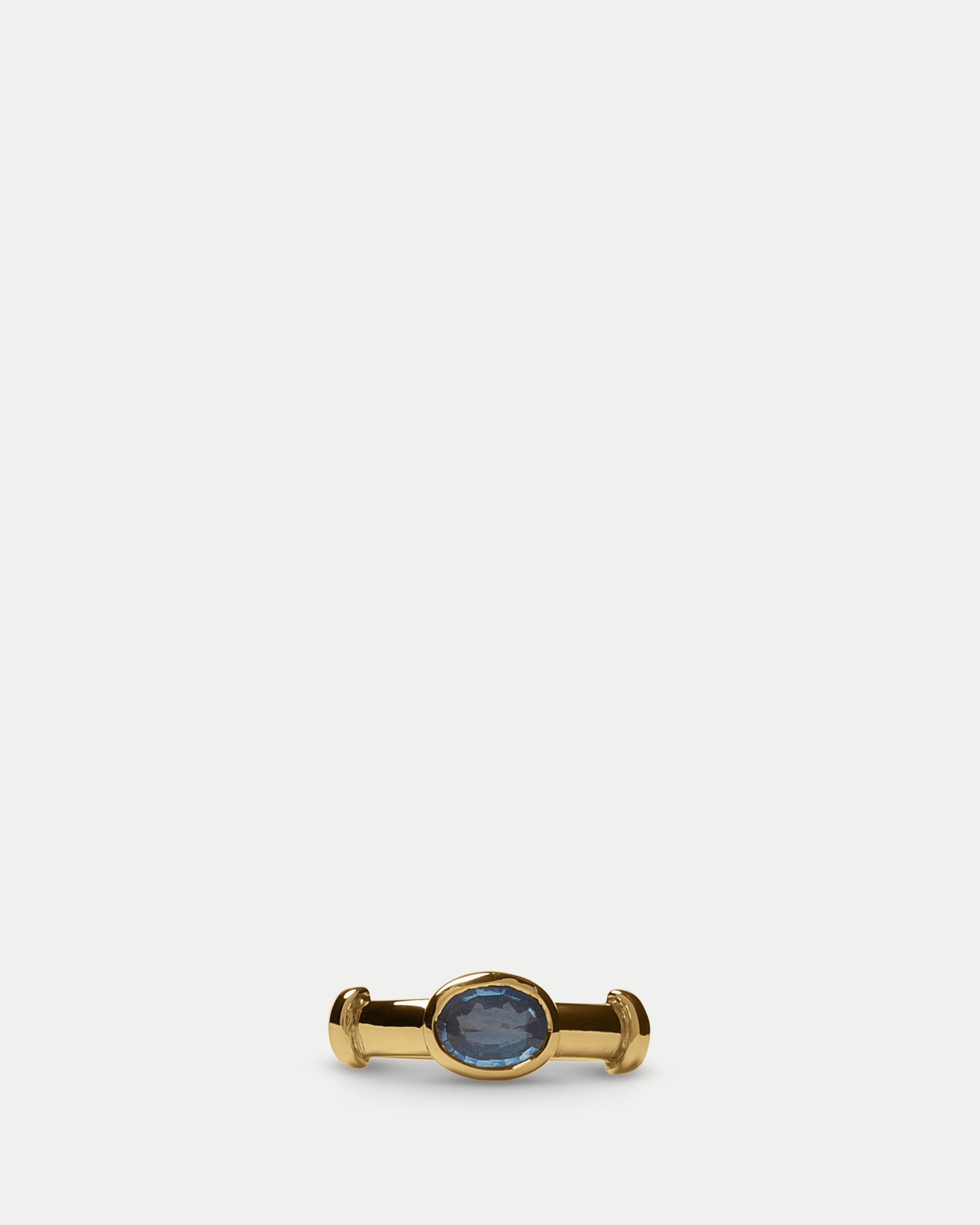 Front view of Orion Solitaire Ring ft. Oval Blue Sapphire in 14k yellow gold